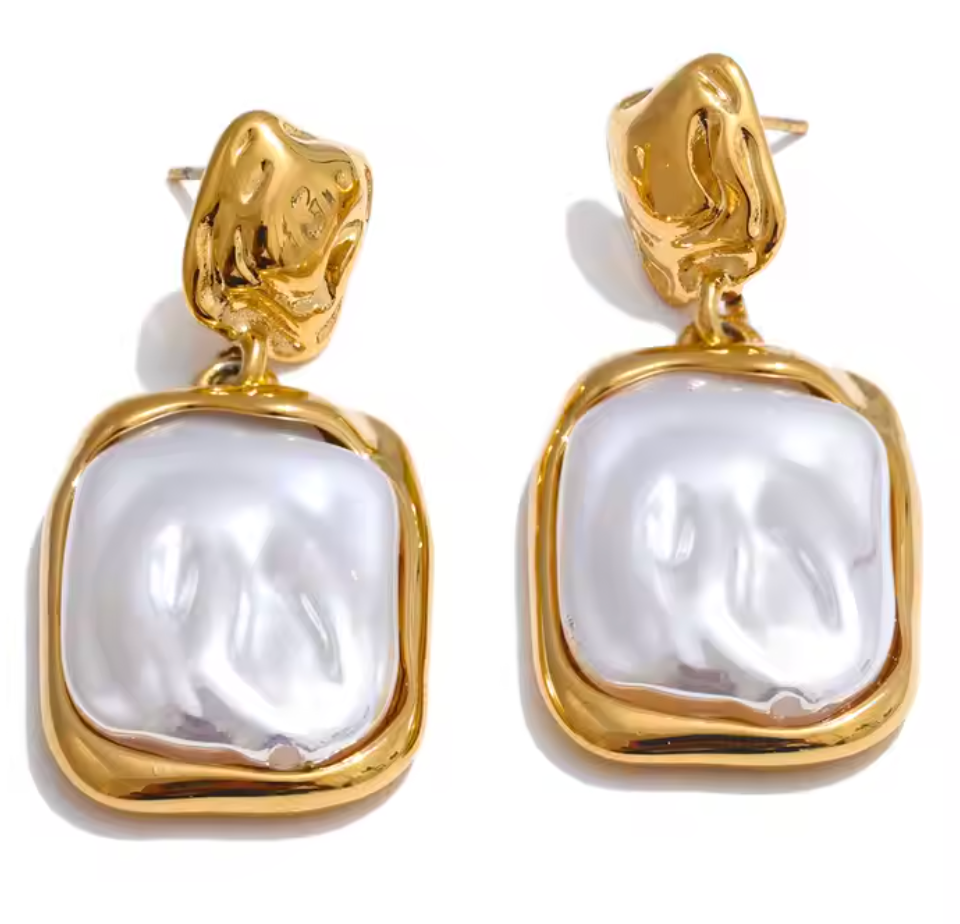 Gold-plated drop earrings with iridescent pearl finish and organic, elongated shape from the RESORT 444 Luxe Latitude Collection.