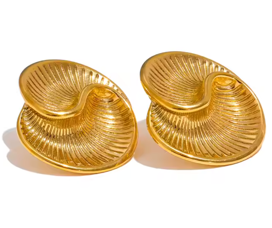 Gold-plated sculptural earrings inspired by conch shells, featuring a wavy, ridged design from the RESORT 444 Luxe Latitude Collection.
