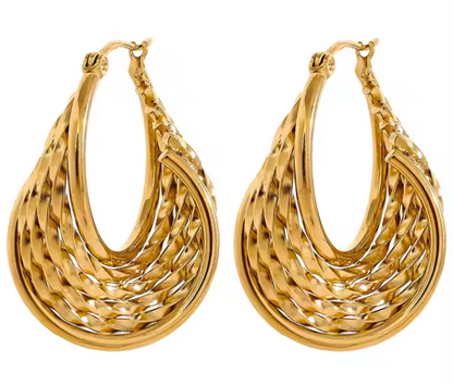 Calypso Earring – Luxe twisted design with sculptural shine, 1.38" length, tarnish-resistant, swim-safe, perfect for elevating any getaway look.