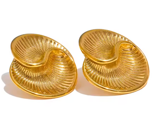 Gold-plated sculptural earrings inspired by conch shells, featuring a wavy, ridged design from the RESORT 444 Luxe Latitude Collection.