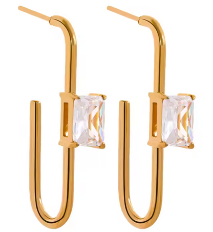 Gold-plated sculptural hoop earrings with a central gemstone and curved design, from the RESORT 444 Luxe Latitude Collection.